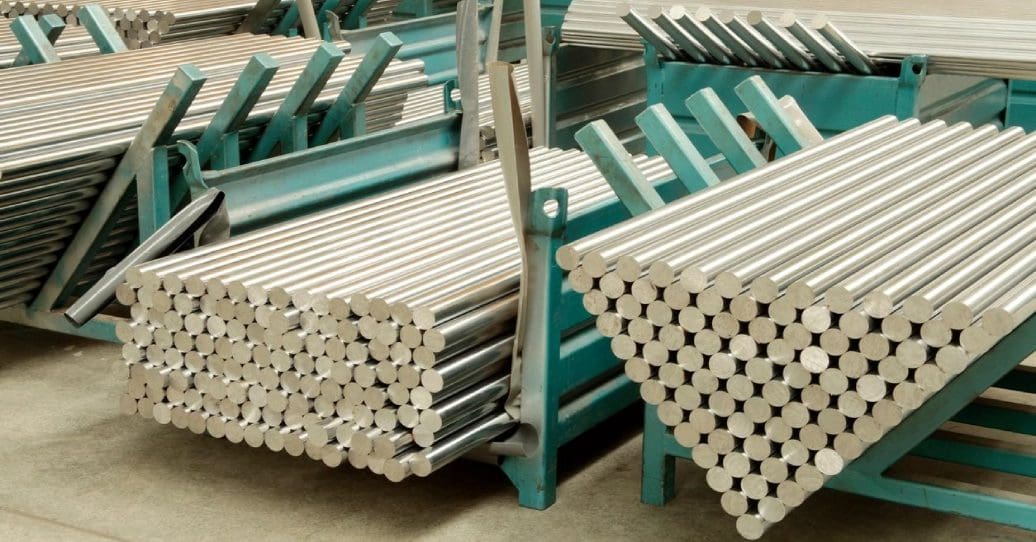 A large amount of metal pipes are stacked on top of each other.