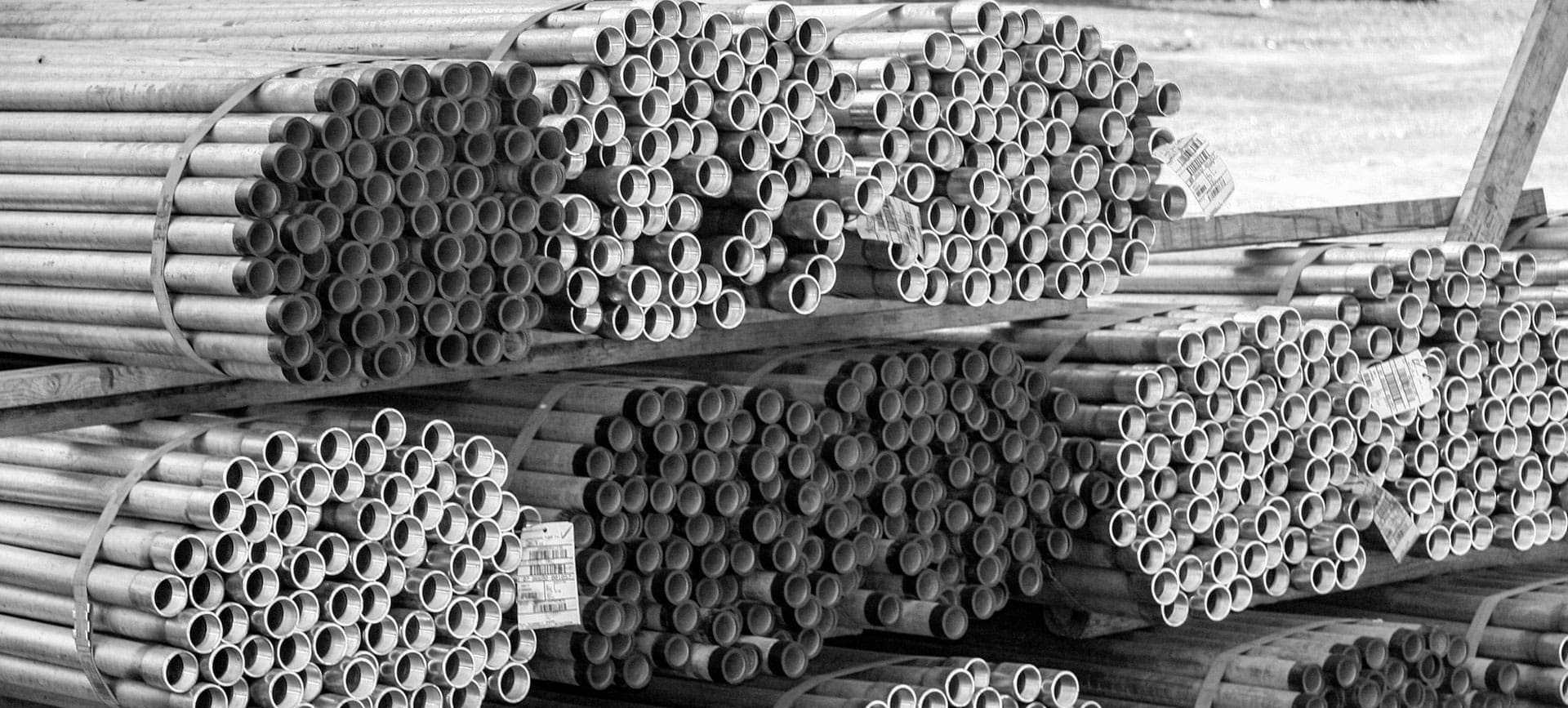 A pile of pipes sitting next to each other.